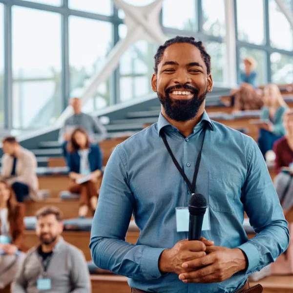 happy-black-public-speaker-during-business-confere-2023-11-27-05-09-01-utc
